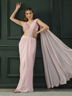 Powder Pink pre-drape georgette saree paired beautifully with a hand-embellished pink pearl blouse.