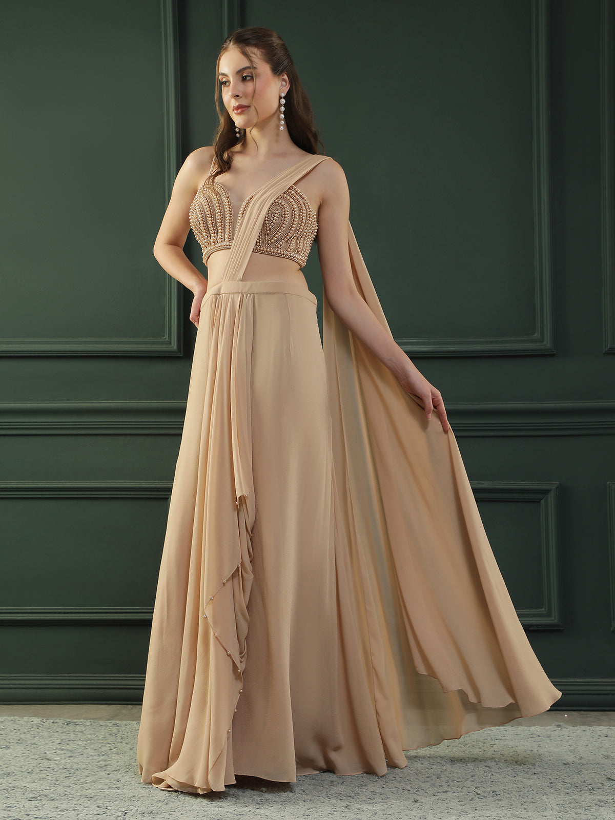 Tan Brown pre-drape georgette saree paired beautifully with a hand-embellished pearl blouse.