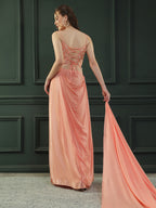 Peach drape skirt paired with brocade corset with a hand-embellished pearl highlight and plain dupatta with latkans drop on its sides.