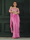 Fuscia Pink crepe drape skirt paired with brocade corset with a hand-embellished pearl highlight and plain dupatta with latkans drop on its sides.
