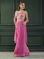 Fuscia Pink crepe drape skirt paired with brocade corset with a hand-embellished pearl highlight and plain dupatta with latkans drop on its sides.