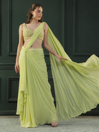 Lime-green pre-drape georgette saree paired beautifully with a hand-embellished pearl blouse.