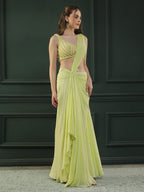 Lime-green pre-drape georgette saree paired beautifully with a hand-embellished pearl blouse.