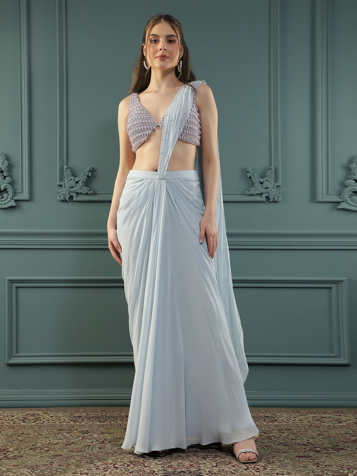 Powder Blue pre-drape georgette saree paired beautifully with a hand-embellished pearl blouse.