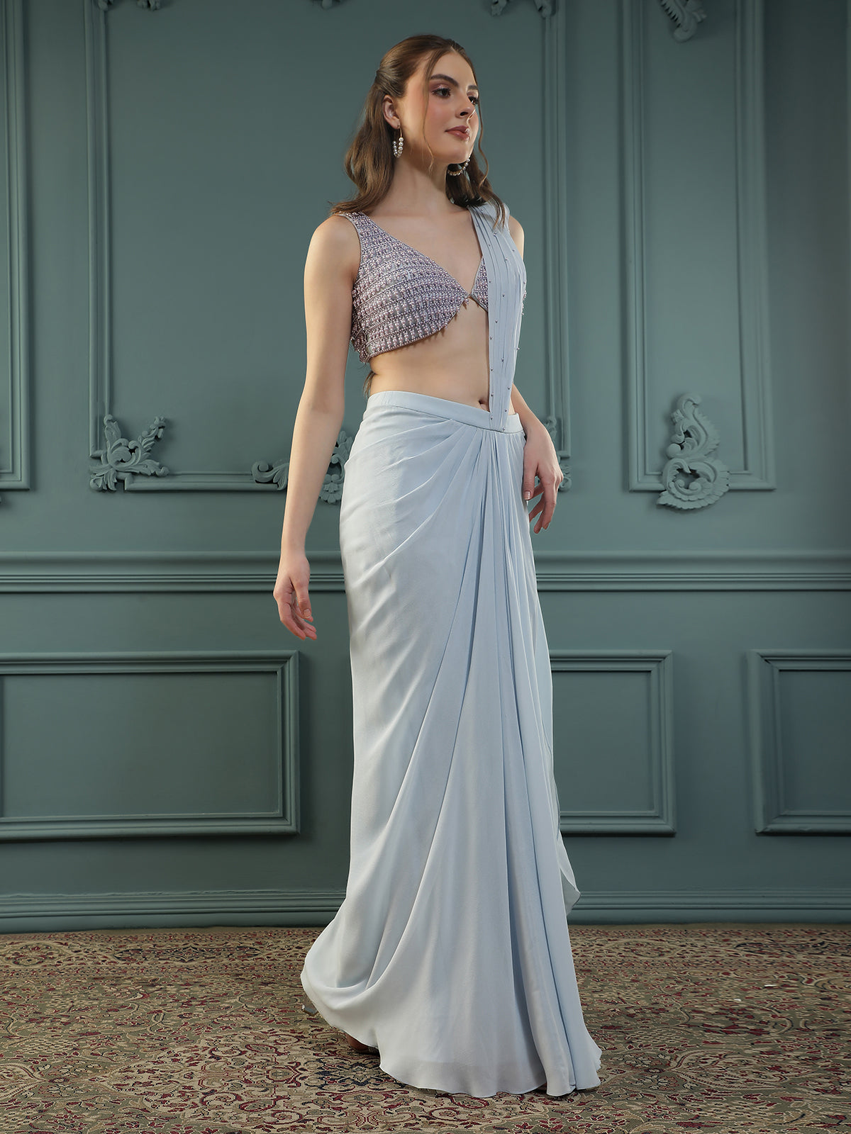 Powder Blue pre-drape georgette saree paired beautifully with a hand-embellished pearl blouse.