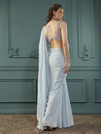 Powder Blue pre-drape georgette saree paired beautifully with a hand-embellished pearl blouse.