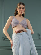 Powder Blue pre-drape georgette saree paired beautifully with a hand-embellished pearl blouse.