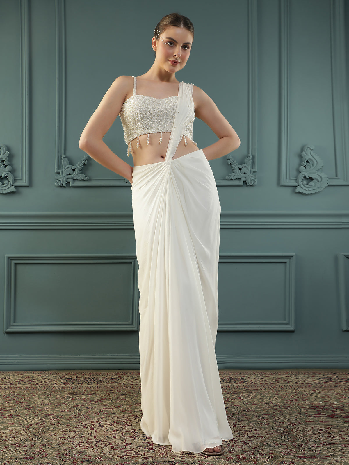 Pearl White pre-drape saree paired with a pearl-encrusted blouse.