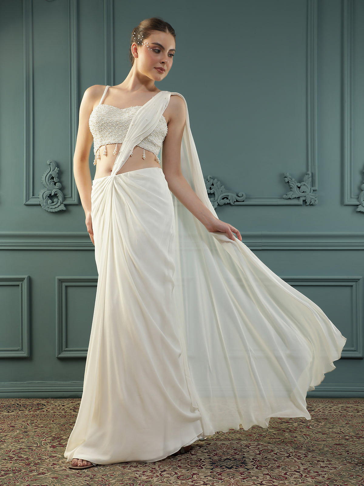 Pearl White pre-drape saree paired with a pearl-encrusted blouse.