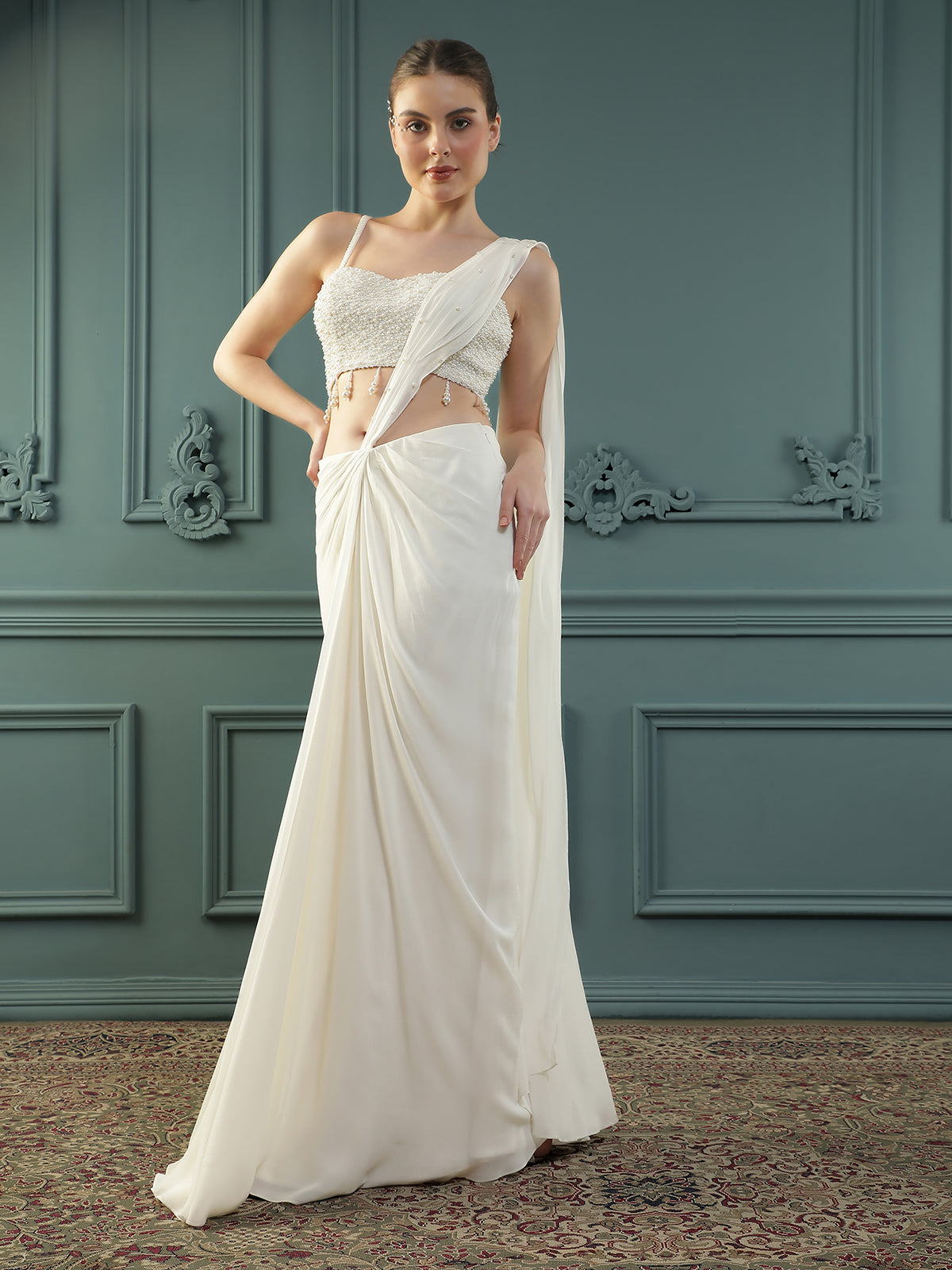 Pearl White pre-drape saree paired with a pearl-encrusted blouse.