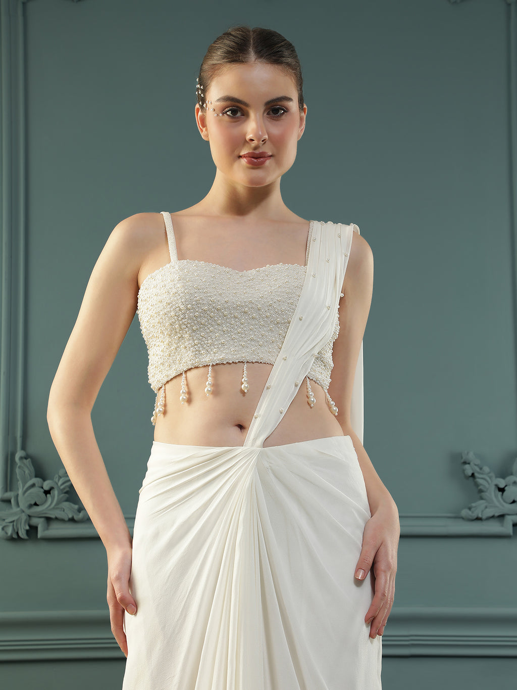 Pearl White pre-drape saree paired with a pearl-encrusted blouse.