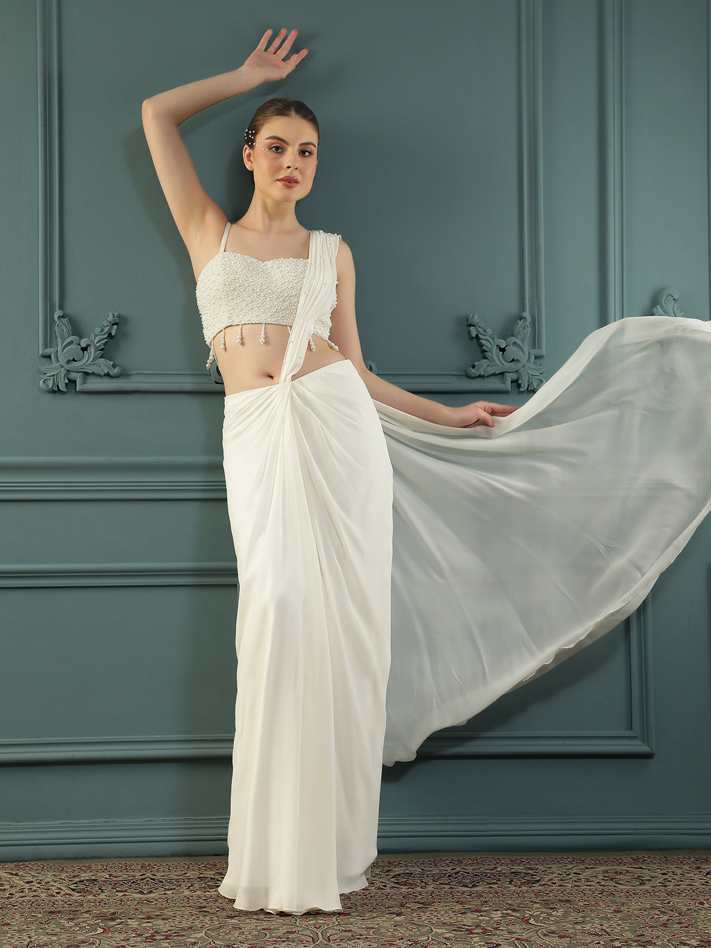 Pearl White pre-drape saree paired with a pearl-encrusted blouse.