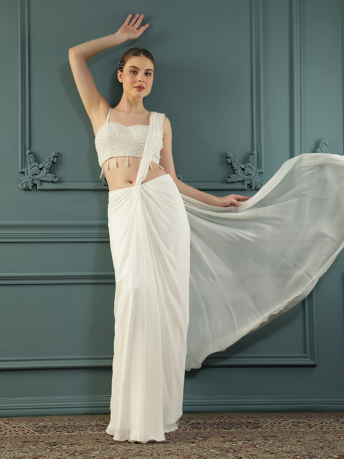Pearl White pre-drape saree paired with a pearl-encrusted blouse.