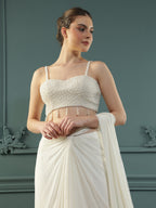 Pearl White pre-drape saree paired with a pearl-encrusted blouse.