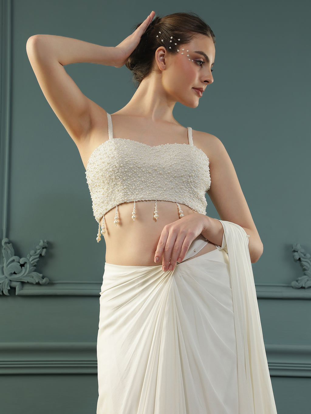 Pearl White pre-drape saree paired with a pearl-encrusted blouse.