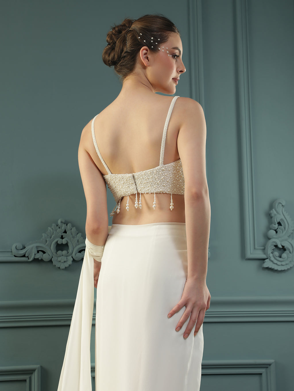 Pearl White pre-drape saree paired with a pearl-encrusted blouse.