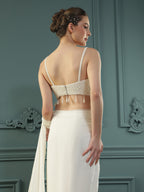 Pearl White pre-drape saree paired with a pearl-encrusted blouse.